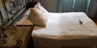 Rotina noturna para dormir melhor: 7 passos simples para desacelerar rotina noturna para dormir melhor com cama arrumada e mesa de cabeceira